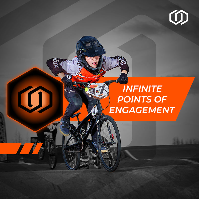 Person on a bike with 'Infinite Points of Engagement' text and logo in the background