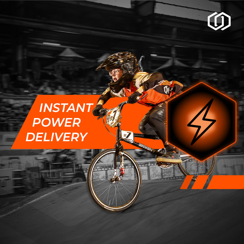 Person on a bike with 'Instant Power Delivery' text and lightning bolt icon in an urban setting